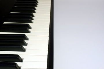 Fototapeta na wymiar Music keyboard on white background close up view with free space for your text, selective focus