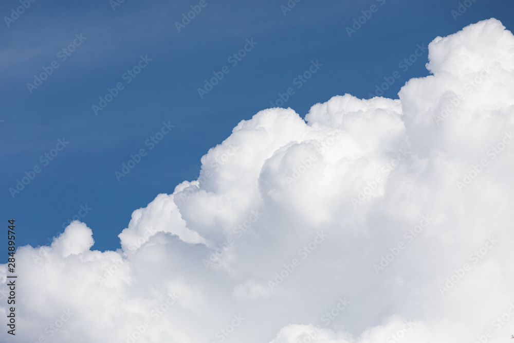 Wall mural fluffy cloud edge and blue sky