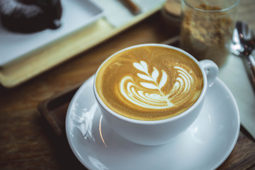 coffee aroma latte cup in the wood table cafe style