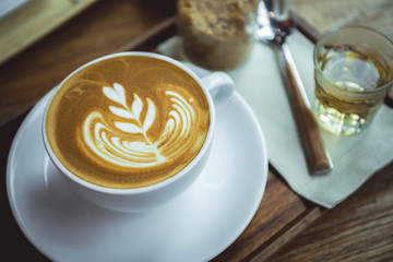 coffee aroma latte cup in the wood table cafe style