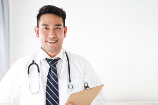 Portait Of Asian Doctor In Hospital White Background