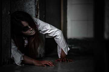 Portrait of asian woman make up ghost face with blood,Horror scene,Scary background,Halloween...