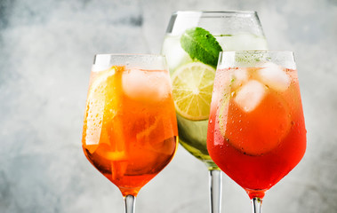 Set of summer Italian alcoholic cocktails, aperol spritz, martini royale, campari tonic with...