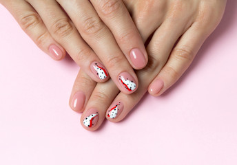 Bright fashionable abstract manicure on female hands.