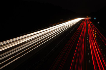 Light trails from cars on highway, lane change