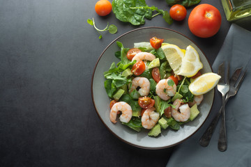 Salad with avocado and shrimps. Healthy fresh salad. Copy space.