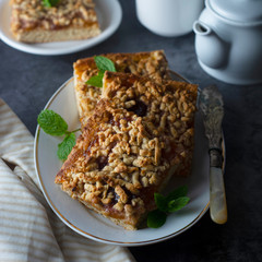 Crumble fruit pie, slice. Homemade cake with fruit jam. Delicious desert.