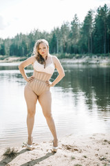 Obraz premium plus size woman with curvy figure in corset lingerie. caucasian xxl chubby girl wanna swimming.