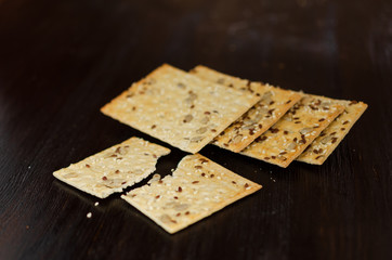 Crunchy multigrain cookies on a dark background. Healthy food concept