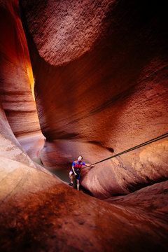 A woman rapelling in Keyhole Canyon, Zion National Park, Utah, USA