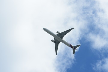 Fototapeta na wymiar A large passenger plane flying through the clouds