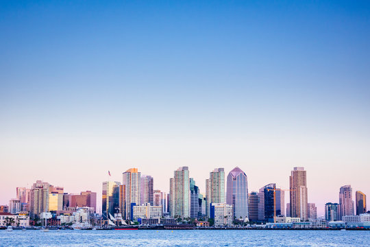 USA. California. San Diego skyline from the harbor at dusk.