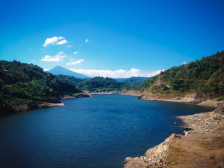 Obraz premium Beautiful View Of Lake Water Titab Ularan Dam Landscape Between The Hills In The Dry Season, North Bali, Indonesia