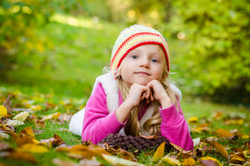 adorable child in beautiful colorful park