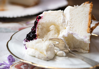 Angel food cake topped with berry sauce