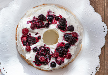 Angel food cake topped with berry sauce
