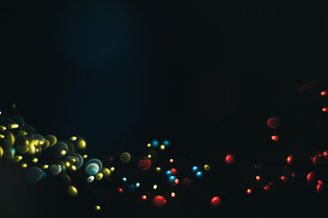 Beautiful multi colored bokeh background on a dark.