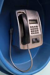 Public telephone in a telephone booth on the street. Russia.