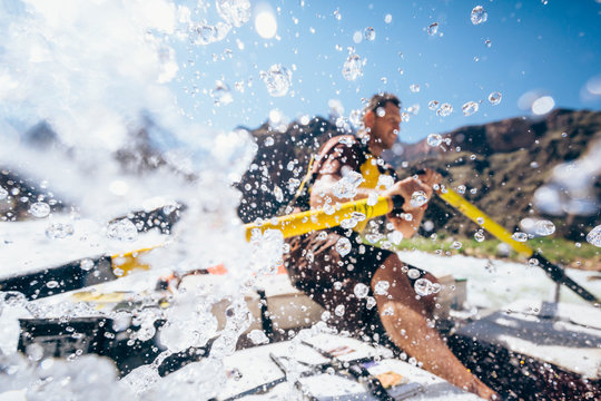Man rows raft through Granite Rapids, Arizona