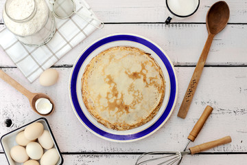 Cooking pancakes. Ingredients, crockery and kitchenware for pancakes.