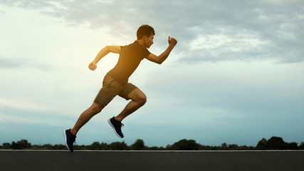 Fototapeta na wymiar Man athlete runner feet running on the road. Concepts jogging outdoors.