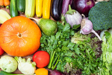 assortment of fresh vegetables on wooden table