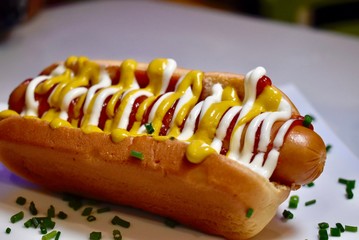hot dog with mustard and ketchup on a plate