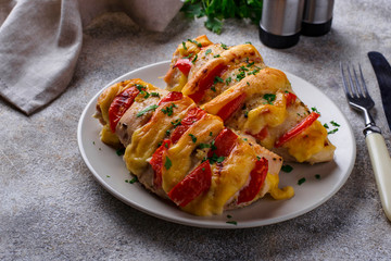 Baked chicken breasts with cheese and tomato