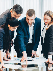 Briefing, brainstorming. Project manager giving instructions to professional team at corporate meeting.