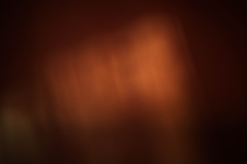 Smeared light reflection. Bronze abstract art background. Blur lens flare design.