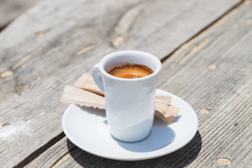 a cup of coffee on wooden background