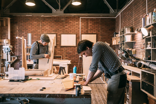 Carpenters working in workshop