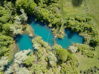 Fototapeta na wymiar Sinjac Lake / Spring in Croatia close to town Plaški and Plitvice Lakes is One of the 15 deepest lakes in the world with 203 m of depth