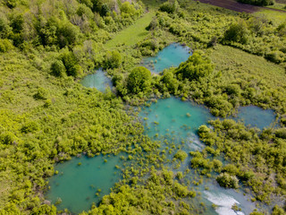 Naklejka na ściany i meble Sinjac Lake / Spring in Croatia close to town Plaški and Plitvice Lakes is One of the 15 deepest lakes in the world with 203 m of depth