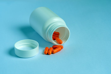 pills and bottle on white background