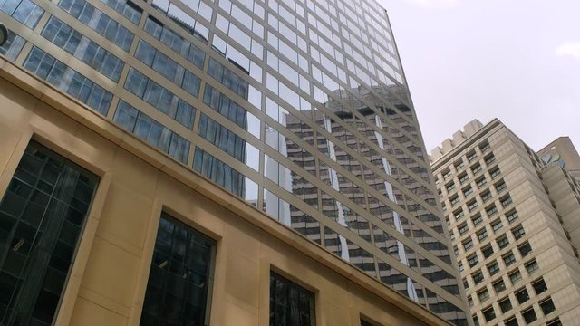 Passing Through a Beautiful Building With a Mirror Coating in Hong Kong, China