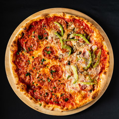 pizza on the black background