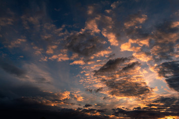 Beautiful colors during sunset. Clouds of golden tones over the blue sky.