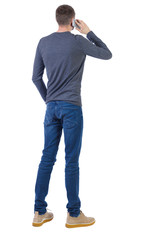 back view of a man talking on the phone