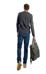back view of walking man with green bag.