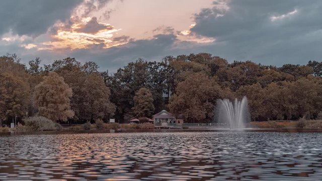 Chemnitz lake, moving clouds over Castle Park with fountain, Timel apse 4K