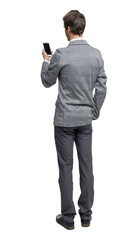 Back view of a businessman who is looking into the smartphone.