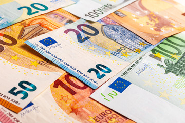 Euro currency banknote background. Close-up of Euro paper money in cash. Different banknotes in European currency on the table. Background from paper money.