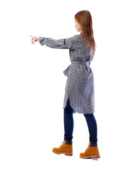 Side view of a girl walking with a pointing hand.
