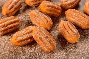 Dulce de leche churro on wooden background