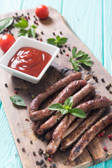 Grilled sausages with tomatoes , pepper and rosemary