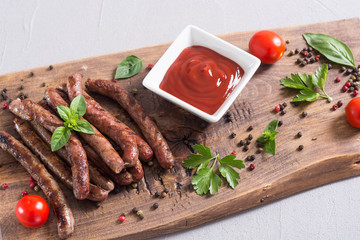 Grilled sausages with tomatoes , pepper and rosemary