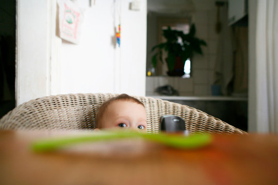 Baby boy months sitting on chair