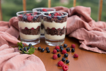 Blueberry,strawberry and raspberry Magnolia Dessert on the wooden table for concept.