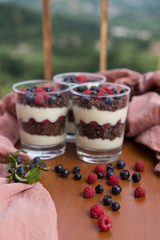 Blueberry,strawberry and raspberry Magnolia Dessert on the wooden table for concept.